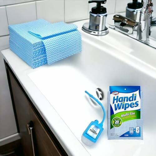 Handi Wipes and soap dispenser on bathroom sink