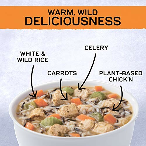 Bowl of plant-based chick'n soup with rice, carrots, and celery.